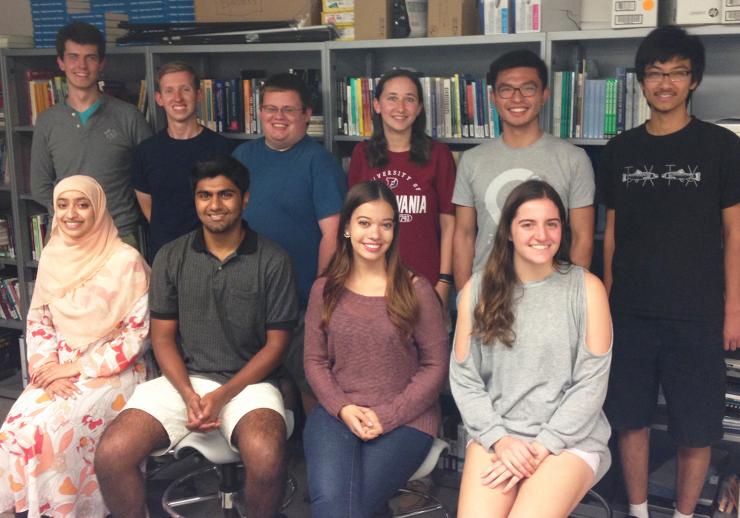 Photo of Sustainable Undergraduate Research Fellows: L to R Front Row Faizah Asif, Kian Halim, Anneke Augenbroe, Gigi Pavur. L to R Back Row: Benjamin Tasistro-Hart, Braden Gilleland, Hayden Mcleod, Ellen Murphy, Leo Chen, Dongyuan He.