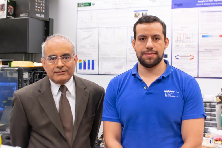 Yogendra Joshi (left) and Daniel Lorenzini stand in Joshi’s lab heat transfer, combustion and energy systems lab