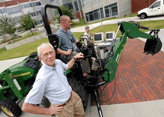 Dr. Wayne Book with student demonstrating research.