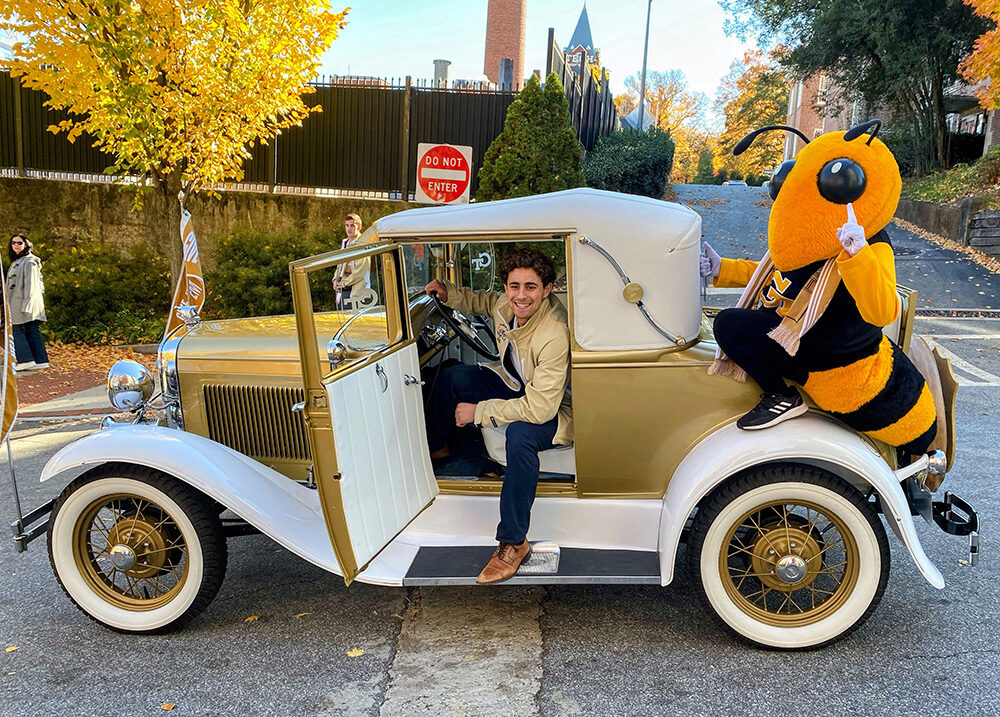 Ethan Rosman and Buzz with Georgia Tech's famous Ramblin' Reck.