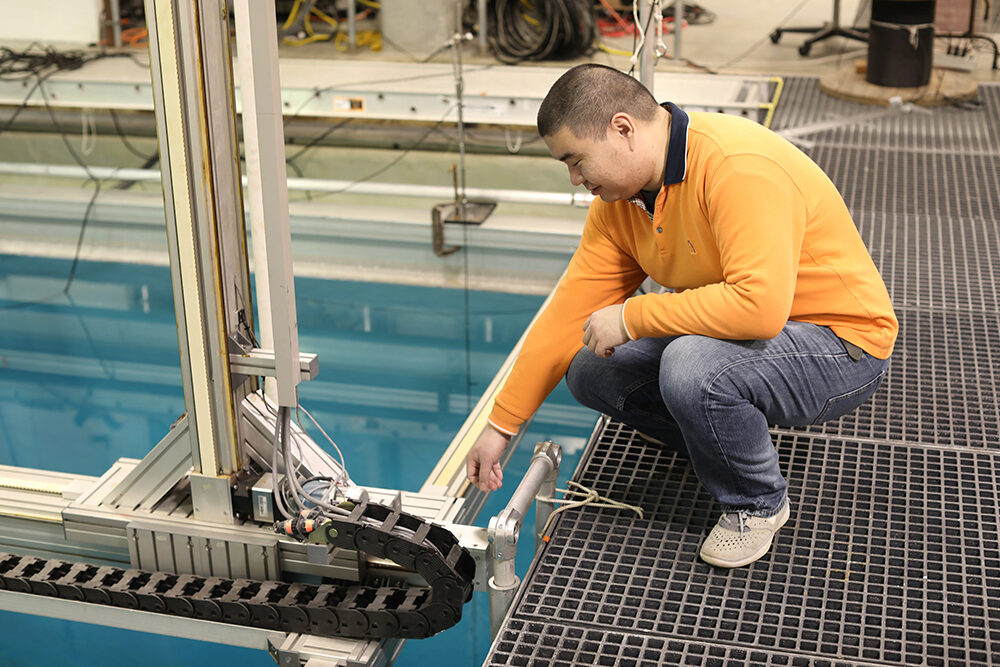 Shi in the Woodruff School's acoustic watertank lab